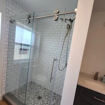 Jlo shower doors storefronts and glass handrails