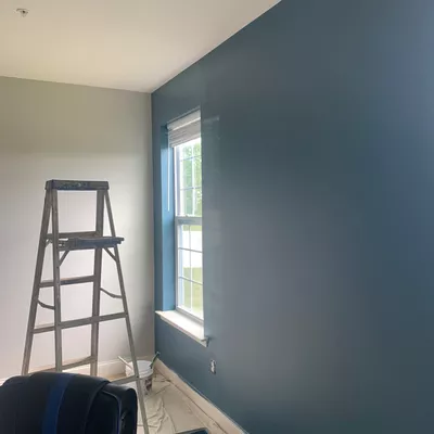 Edwin and son painting drywall and plastering